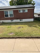 View of home's exterior featuring brick siding