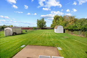 Fenced backyard with a shed