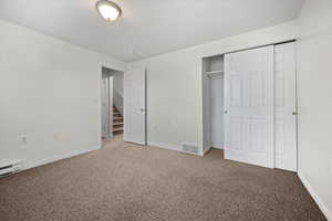 Unfurnished bedroom with carpet floors and a closet