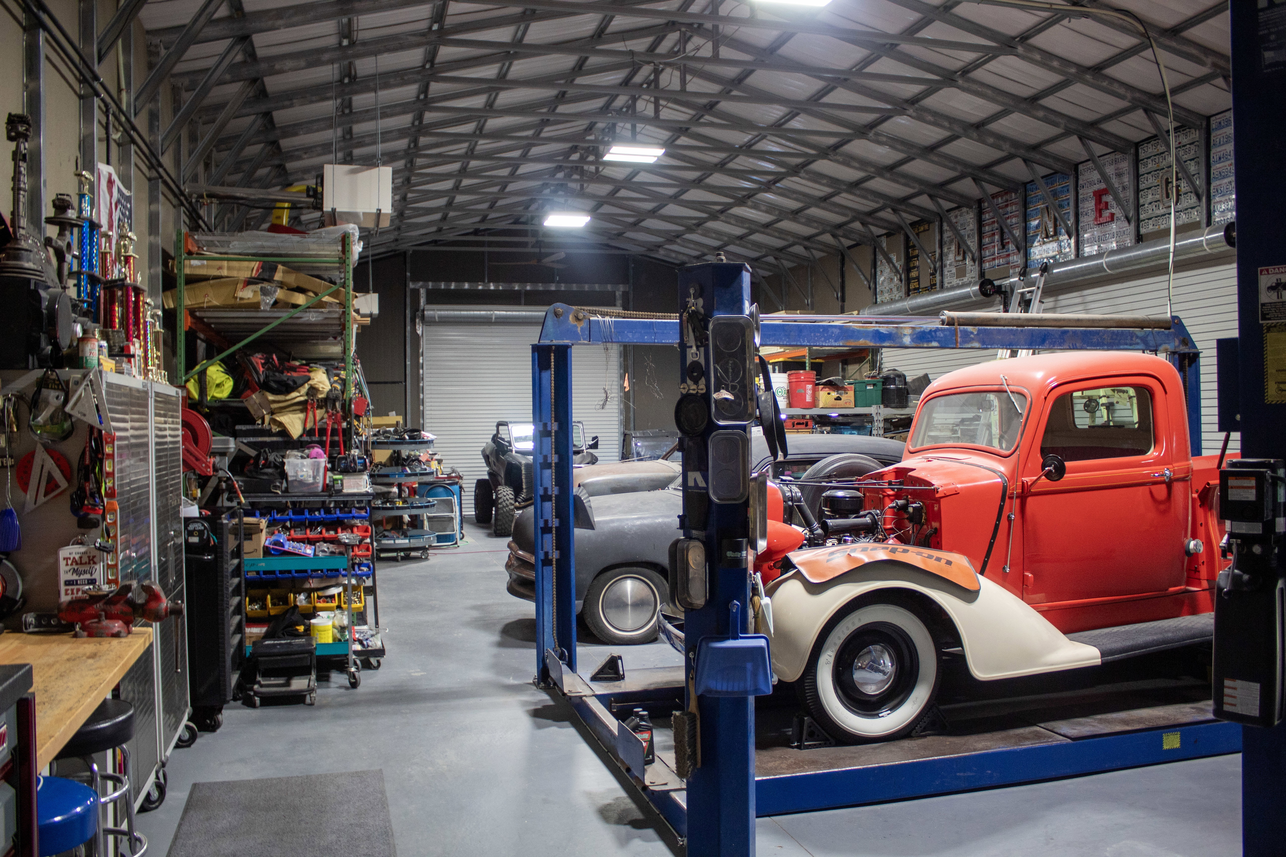 Garage with metal wall and a workshop area