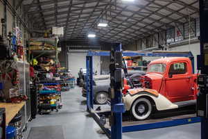 Garage with metal wall and a workshop area