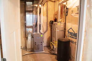 Utilities featuring water heater and heating unit