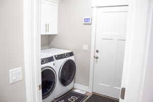 Laundry area with washing machine and clothes dryer and cabinet space