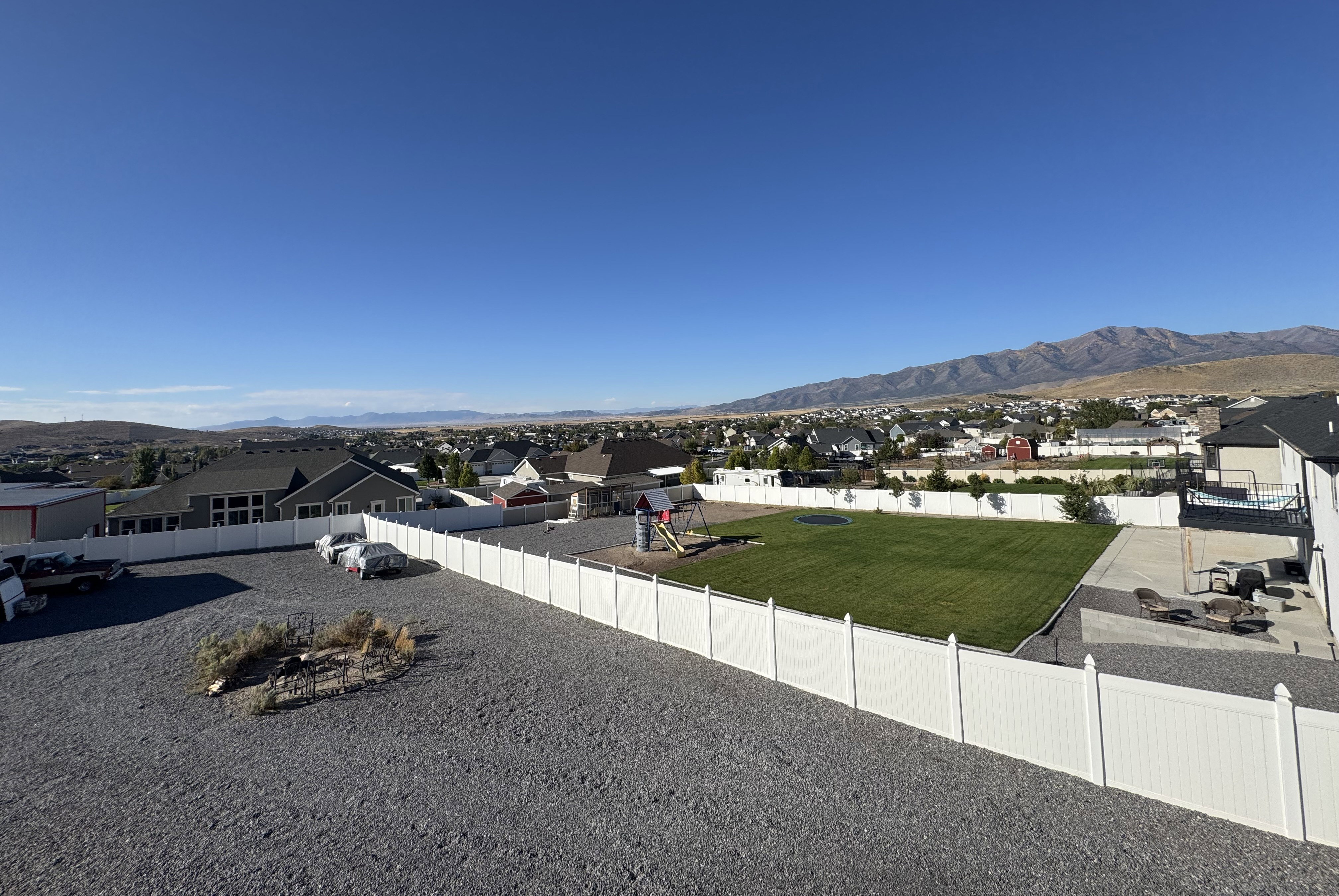 View of mountain background featuring nearby suburban area