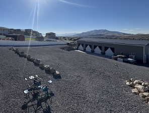 View of yard with a mountain view and an outbuilding