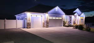Garage at twilight with driveway