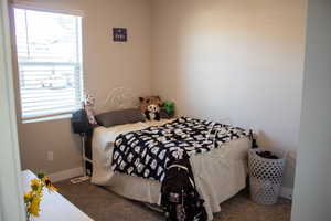 Carpeted bedroom with baseboards