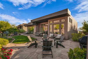 View of patio featuring grilling area, an outdoor living space, and outdoor dining space