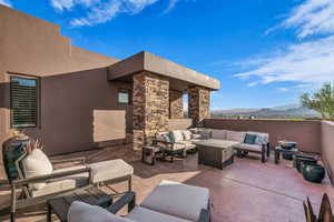 View of patio / terrace with a mountain view and an outdoor hangout area