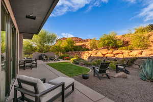 View of patio with outdoor dining area and a mountain view