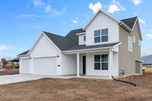 Modern inspired farmhouse featuring board and batten siding, concrete driveway, roof with shingles, a garage, and a porch