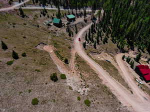 Aerial view of property and surrounding area featuring rural landscape