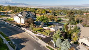 Aerial view of residential area featuring a mountainous background