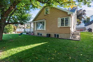 Rear view of house featuring brick siding