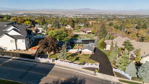 Aerial view of property's location featuring nearby suburban area and a mountain backdrop