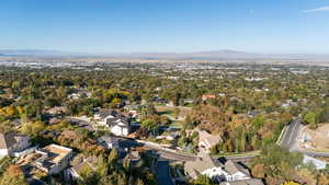 View of property location featuring mountains and nearby suburban area