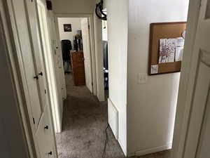 Corridor featuring carpet floors