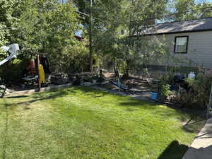 View of yard with a patio