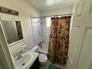 Full bathroom featuring shower / tub combo and vanity