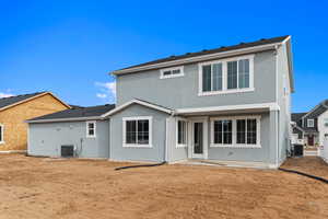 Rear view of house featuring a patio area and stucco siding