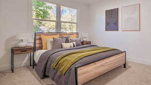 Bedroom featuring baseboards and light colored carpet