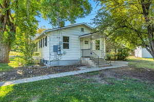 Bungalow-style home with an outbuilding