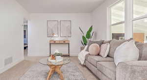 Living area with carpet flooring and baseboards