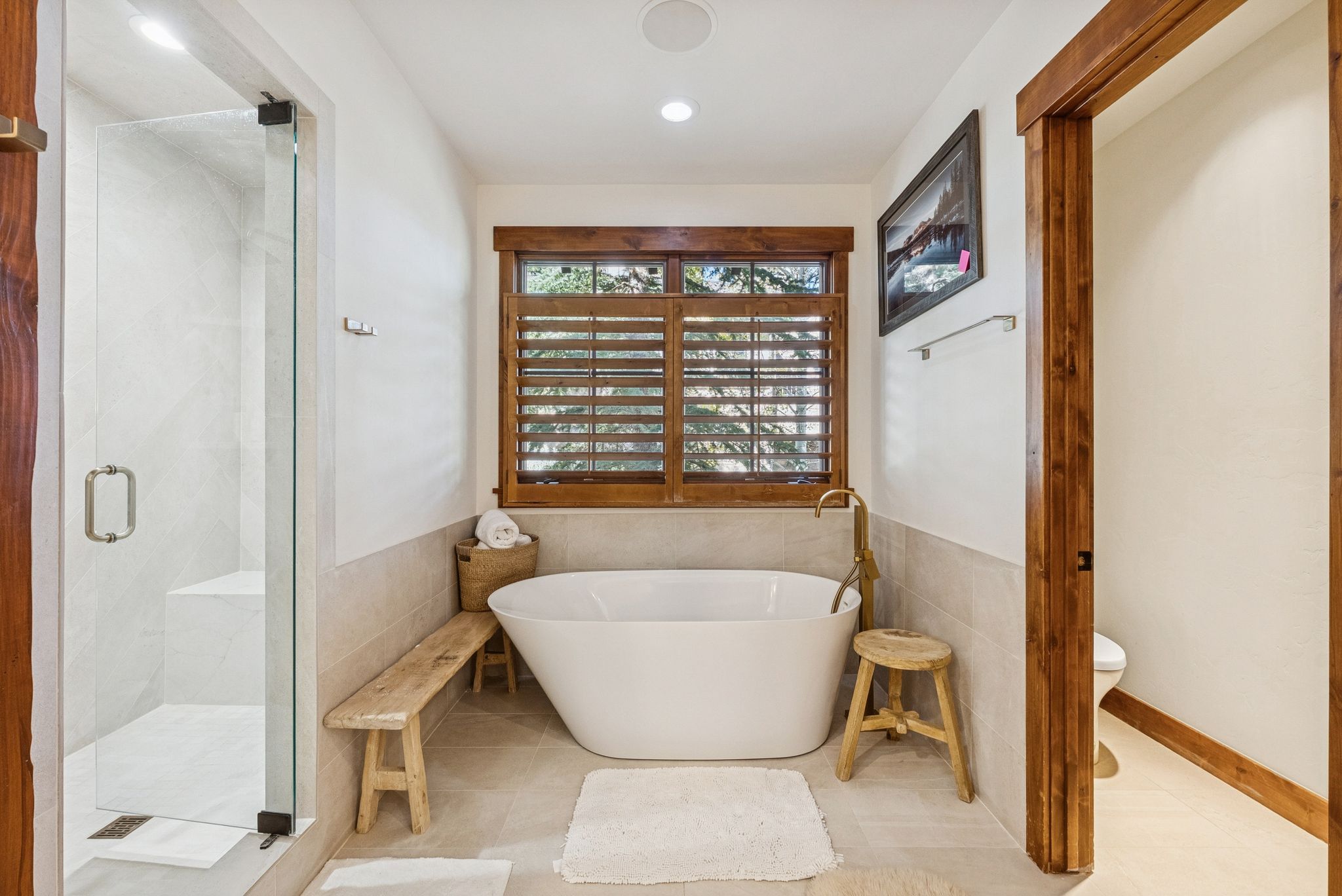 Full bath with a soaking tub, a marble finish shower, tile walls, tile patterned flooring, and recessed lighting