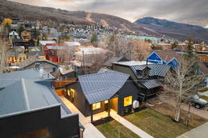 View of mountain background featuring nearby suburban area