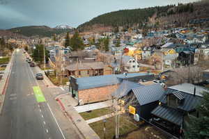 Aerial view of residential area featuring a mountain backdrop