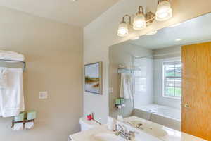 Full bathroom featuring tub / shower combination and vanity