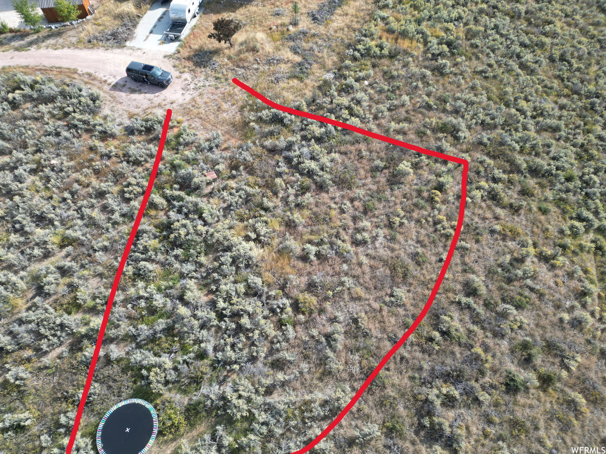 Aerial overview of property's location featuring property parcel outlined