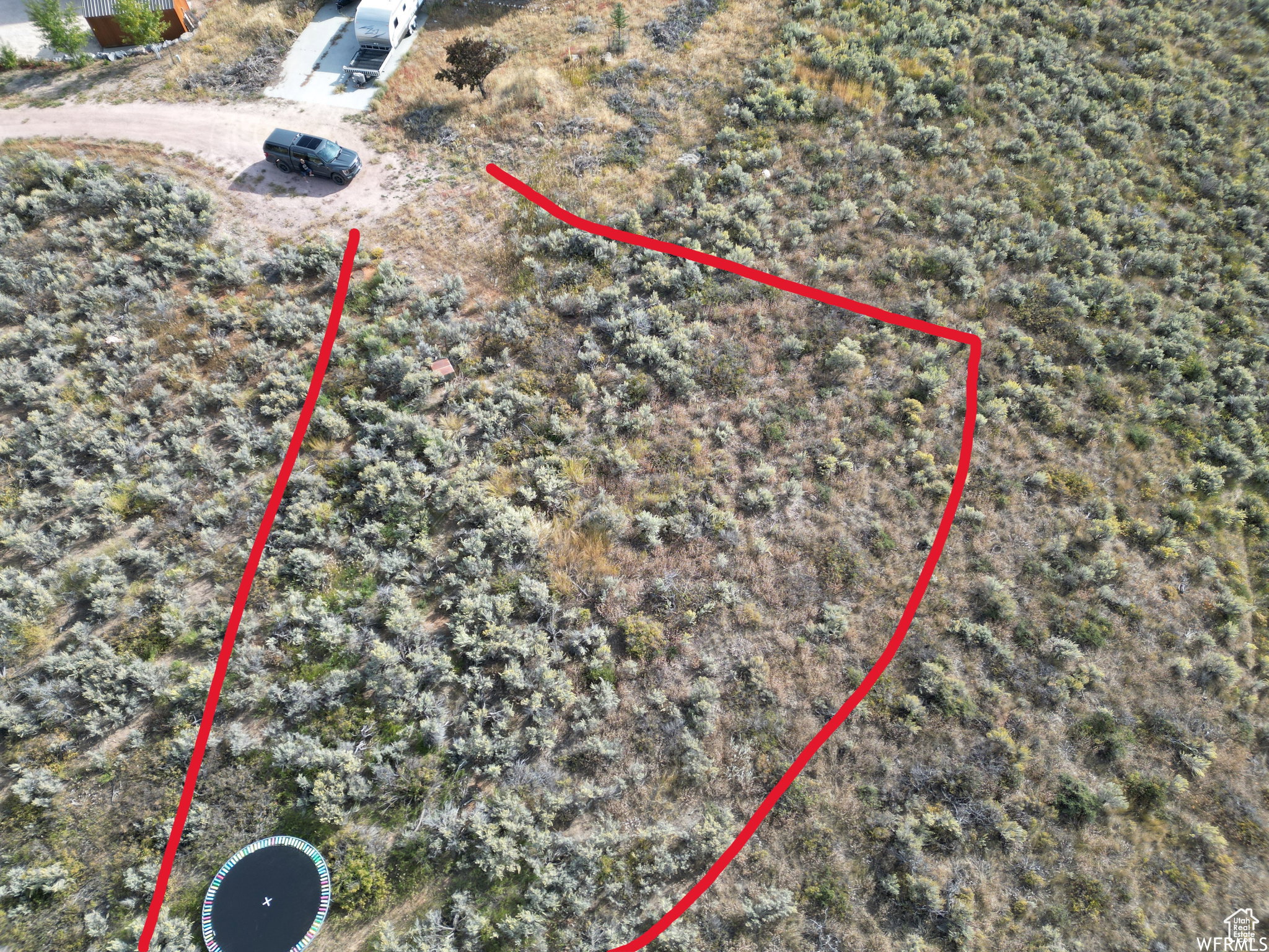 Aerial view of property's location featuring property parcel outlined