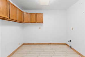 Laundry area with baseboards