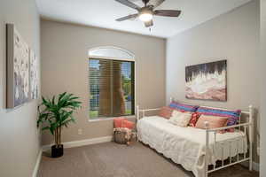 Bedroom featuring carpet floors and ceiling fan