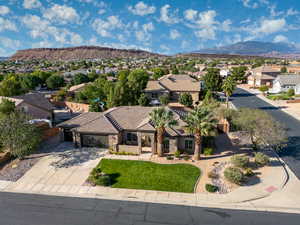 Aerial perspective of suburban area featuring a mountain backdrop