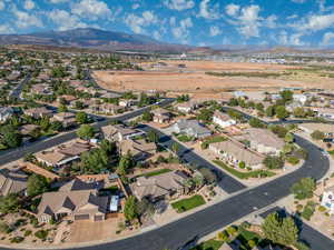 View of property location featuring a mountain backdrop and nearby suburban area