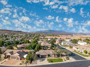 Aerial perspective of suburban area featuring a mountain backdrop