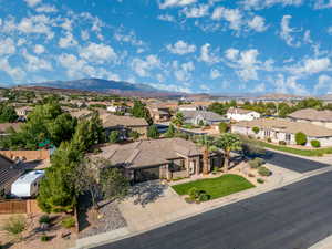 Aerial perspective of suburban area featuring a mountain backdrop