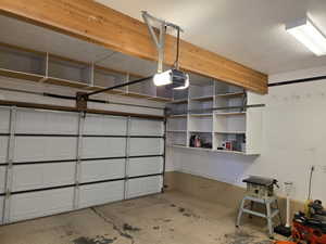 Garage featuring a garage door opener