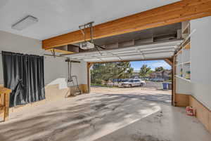 Garage featuring a garage door opener