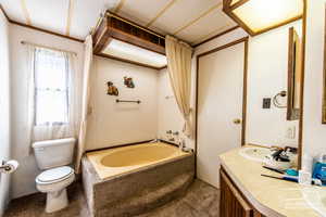 Bathroom with a bath and vanity