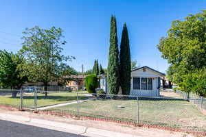 Bungalow with a fenced front yard