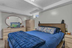 Carpeted bedroom with a textured ceiling