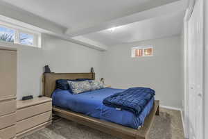 Bedroom with carpet and baseboards