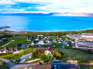 Aerial perspective of suburban area featuring a water and mountain view