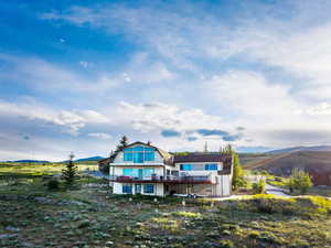Rear view of house with a mountain view