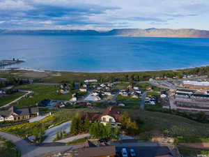 View of property location with nearby suburban area and a water and mountain view