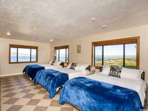 Bedroom with tile patterned floors and a textured ceiling
