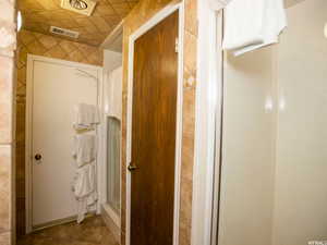 Bathroom featuring a stall shower and tile patterned floors